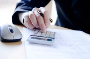 business person with calculator