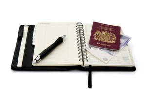 Passport with diary open on expenses page