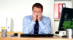 tired-young-businessman-in-the-office-300x168